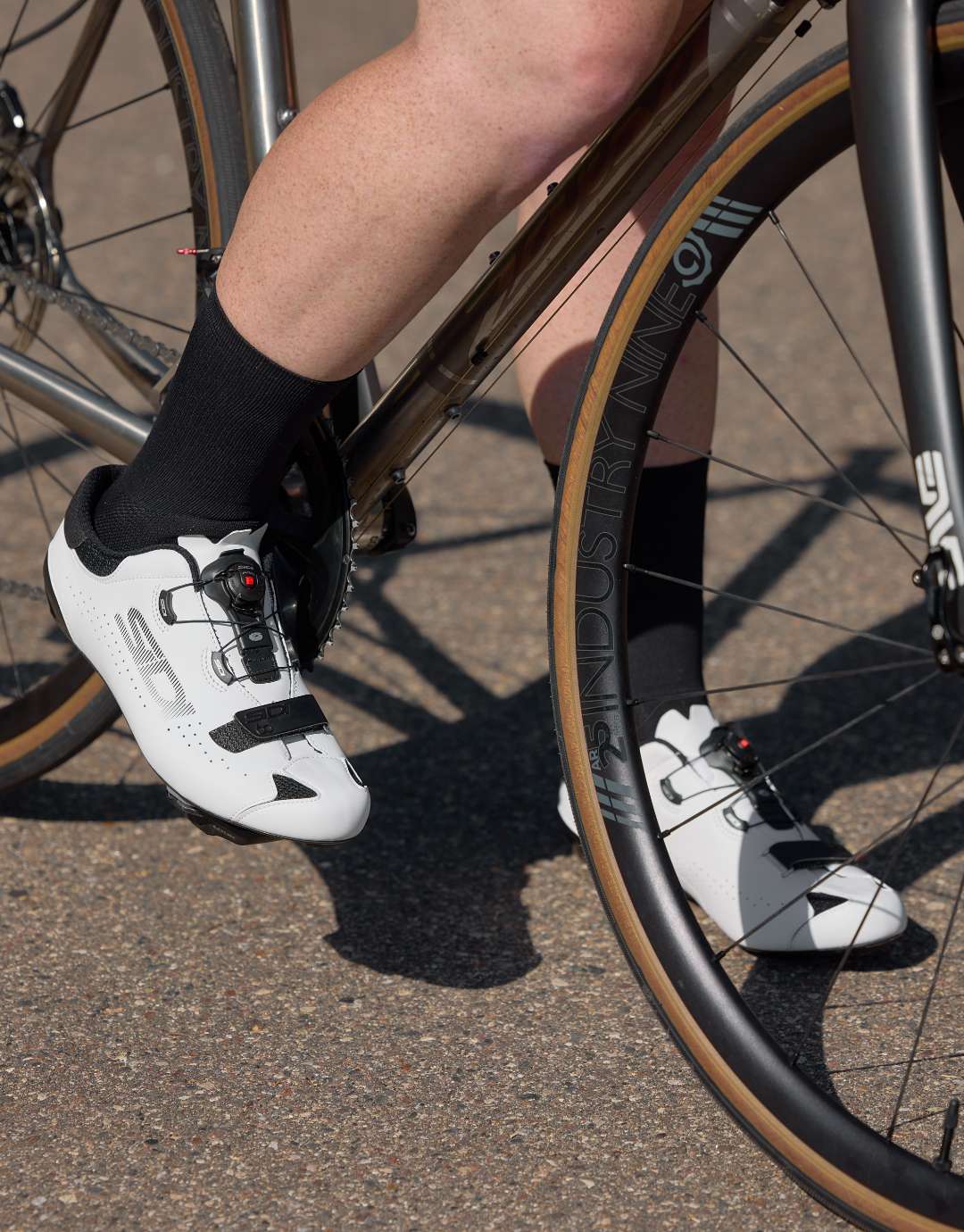 Cyclist on bike wearing SIDI high performance dial system white shoes