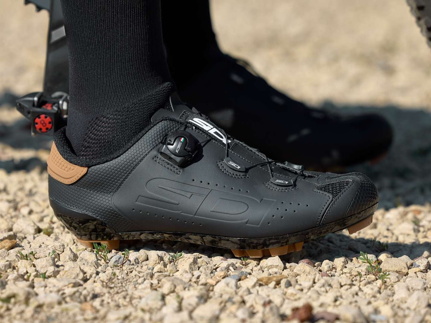 Cyclist wear black sidi dial system shoes