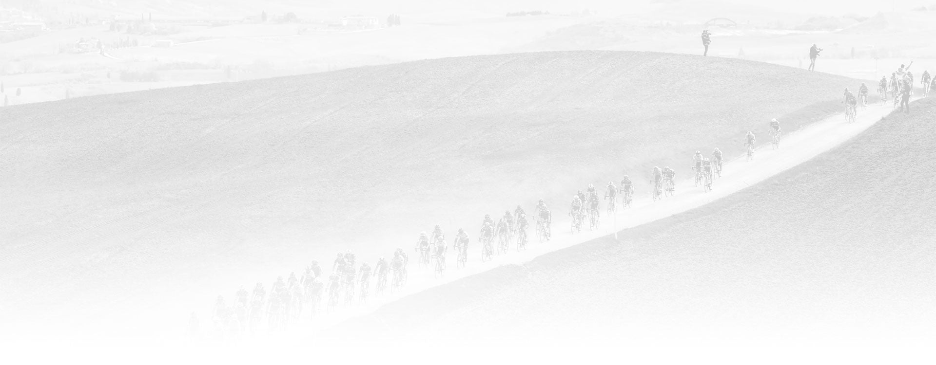 Pale dirt landscape with Bike racing occurring