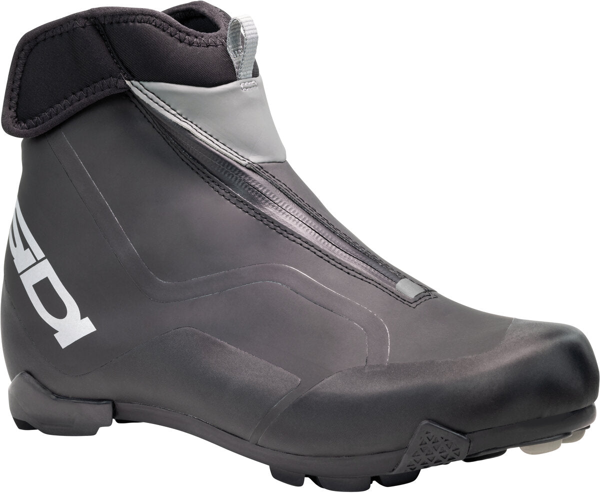 Gray ski boot with a brand logo on a white background