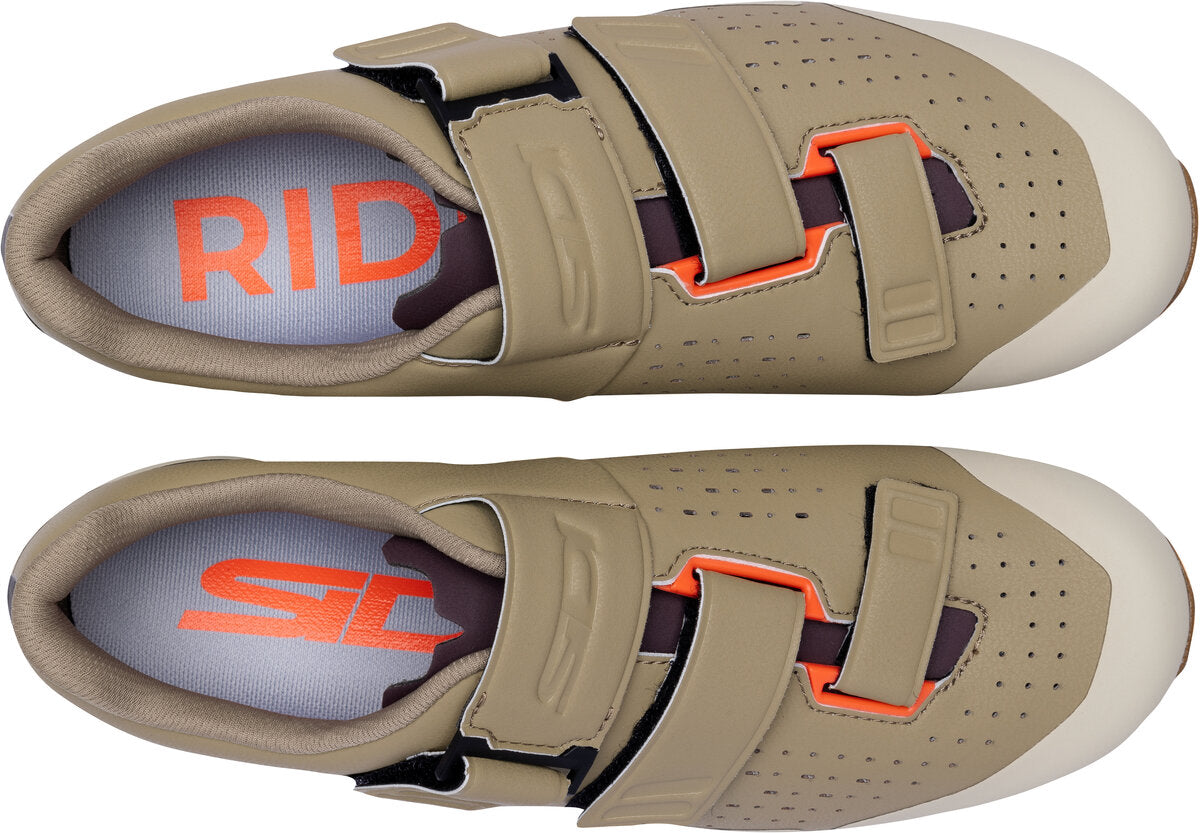 Pair of beige cycling shoes with orange accents on a white background