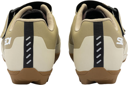 Pair of beige and brown cycling shoes with black accents on a white background