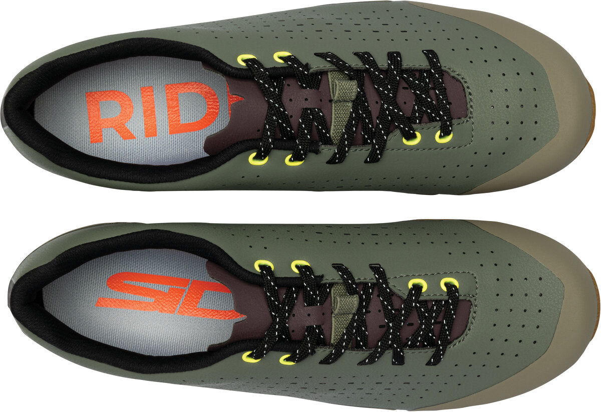 Pair of green athletic shoes with 'RIDE' branding on a white background