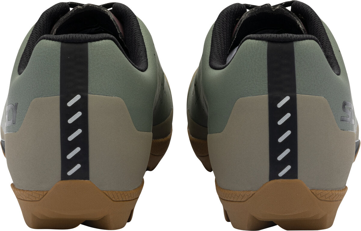 Pair of green and brown shoes with a white sole on a white background