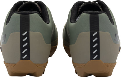 Pair of green and brown shoes with a white sole on a white background