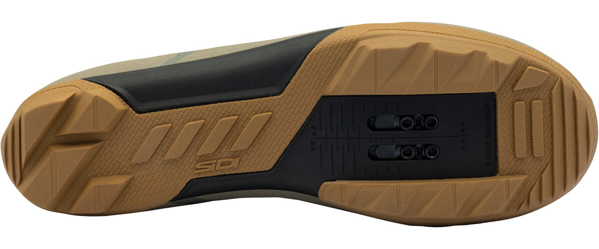 Close-up of a brown and black sole with 'Sidi' branding on a white background