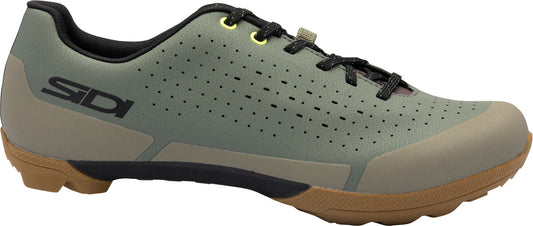 Green cycling shoe with brown sole on a white background