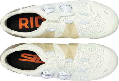 Pair of white cycling shoes with orange and black 'Rid' branding on a white background