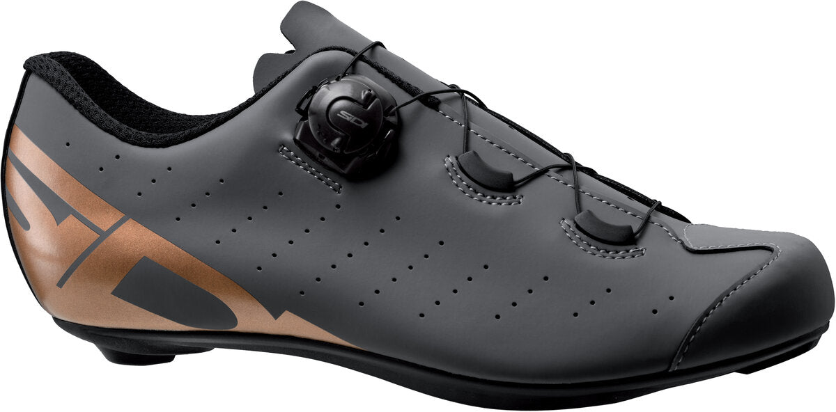Black cycling shoe with brown accents on a white background