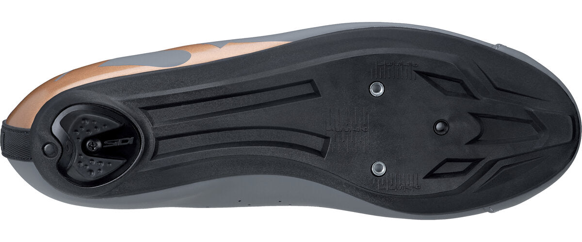 Close-up of a cycling shoe sole with cleat compatibility features on a white background