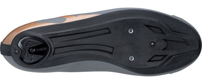 Close-up of a cycling shoe sole with cleat compatibility features on a white background