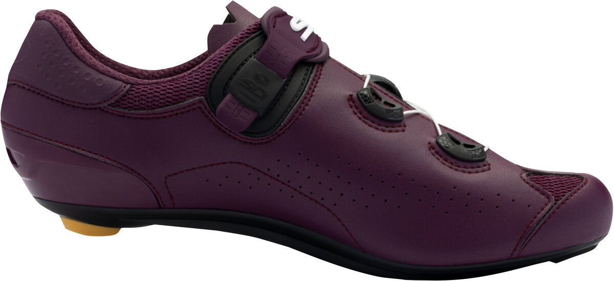 Purple cycling shoe with a white background