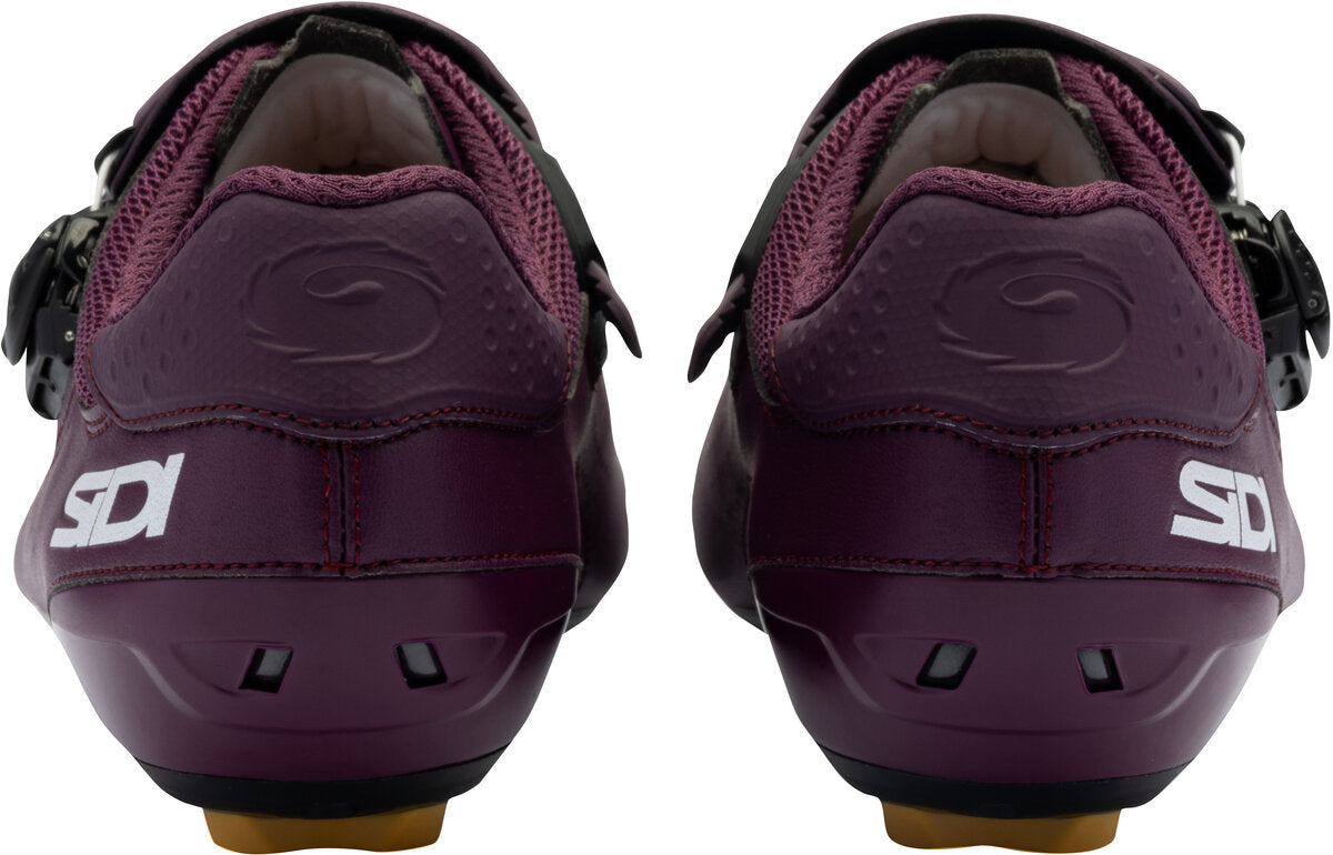 Pair of purple cycling shoes with Sidi logo on a white background