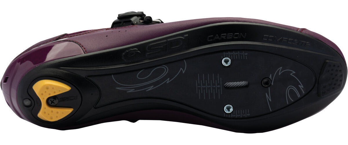 Close-up of a purple and black shoe sole with brand logo