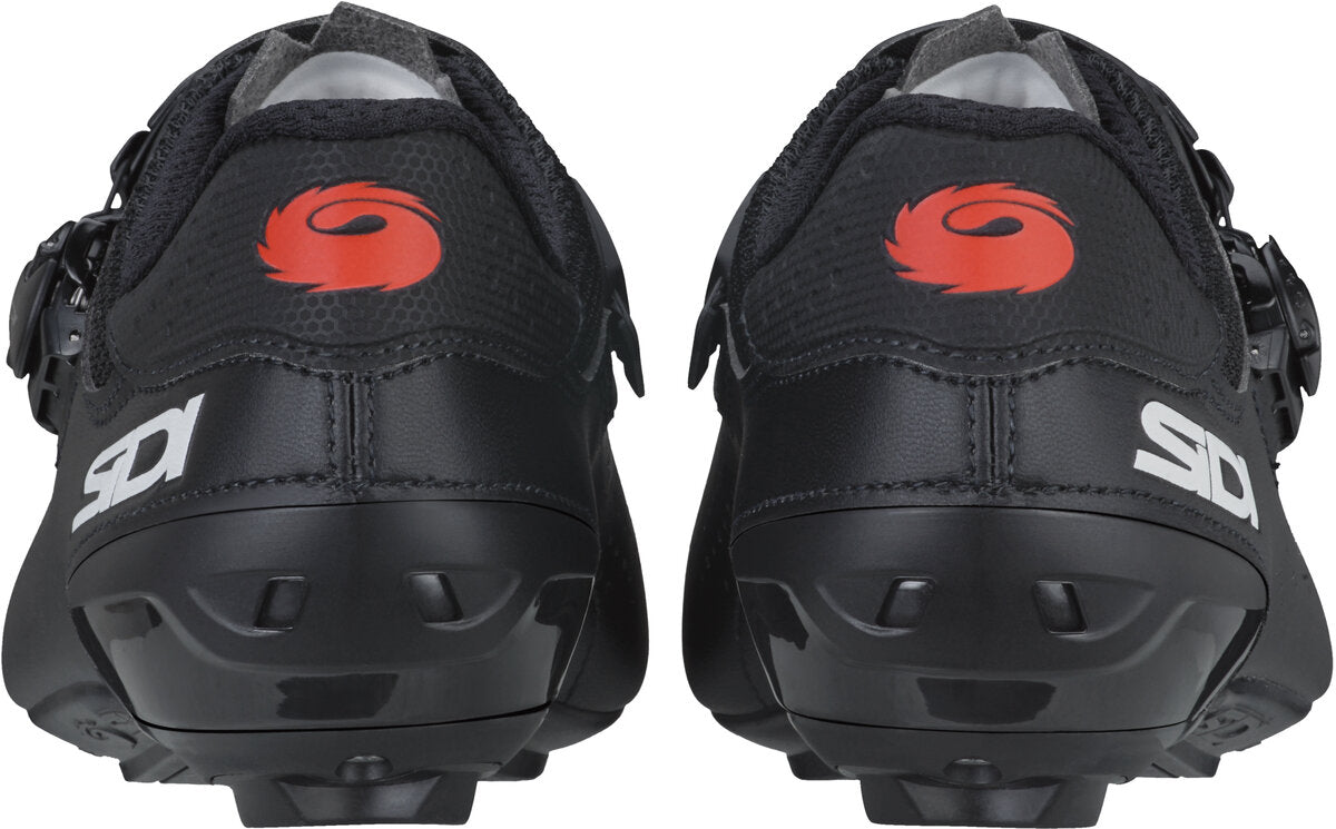 Black cycling shoes with red logo and Sidi branding on a white background