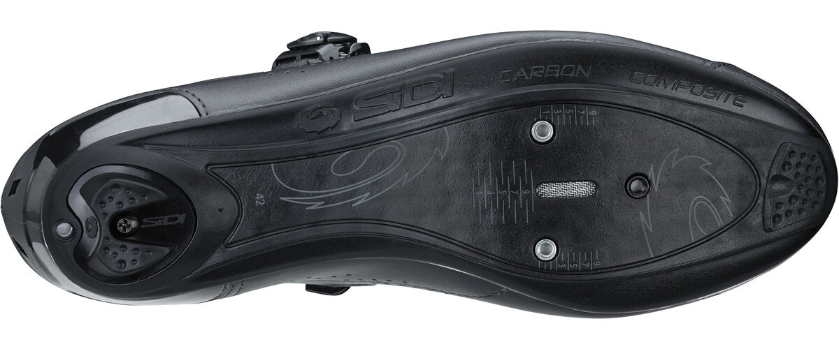 Close-up of a black cycling shoe sole with brand logos on a white background