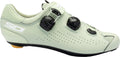 Light green cycling shoe with black components on a white background