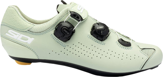 Light green cycling shoe with black components on a white background