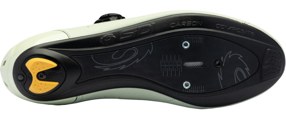 Close-up of a shoe sole with brand logos on a white background