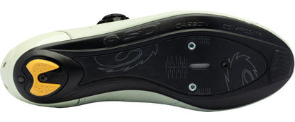 Close-up of a shoe sole with brand logos on a white background
