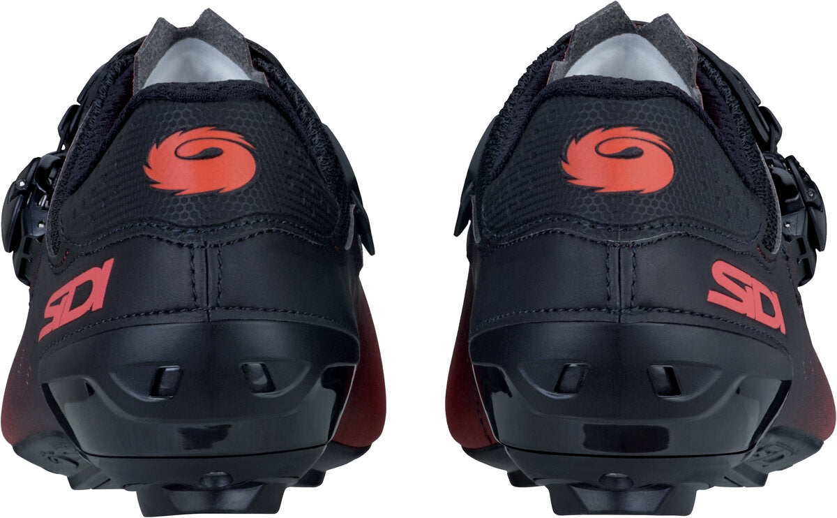 Black cycling shoes with red logo on a white background