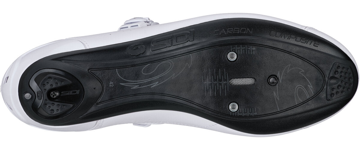 Close-up of a white cycling shoe sole with brand logos on a white background