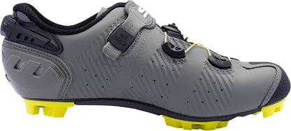 Gray cycling shoe with yellow sole on a white background
