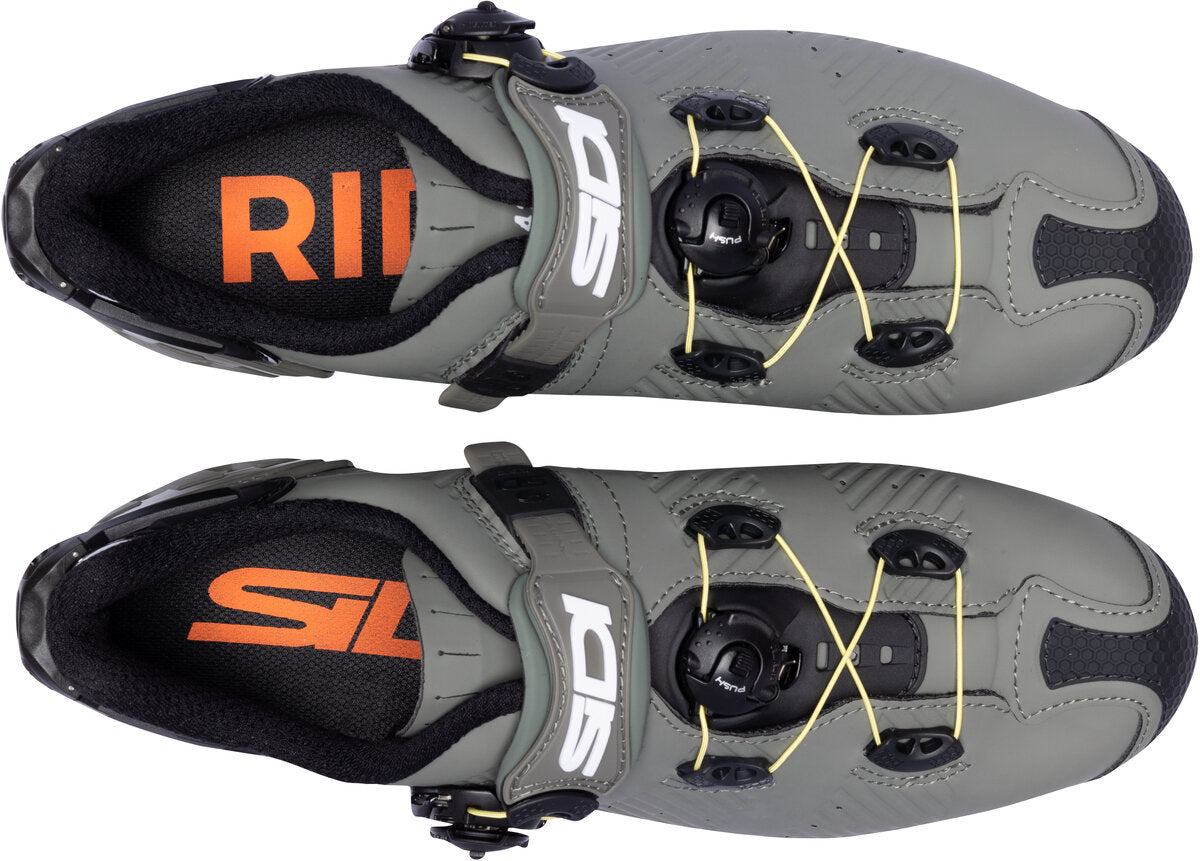 Gray cycling shoes with orange and black branding on a white background