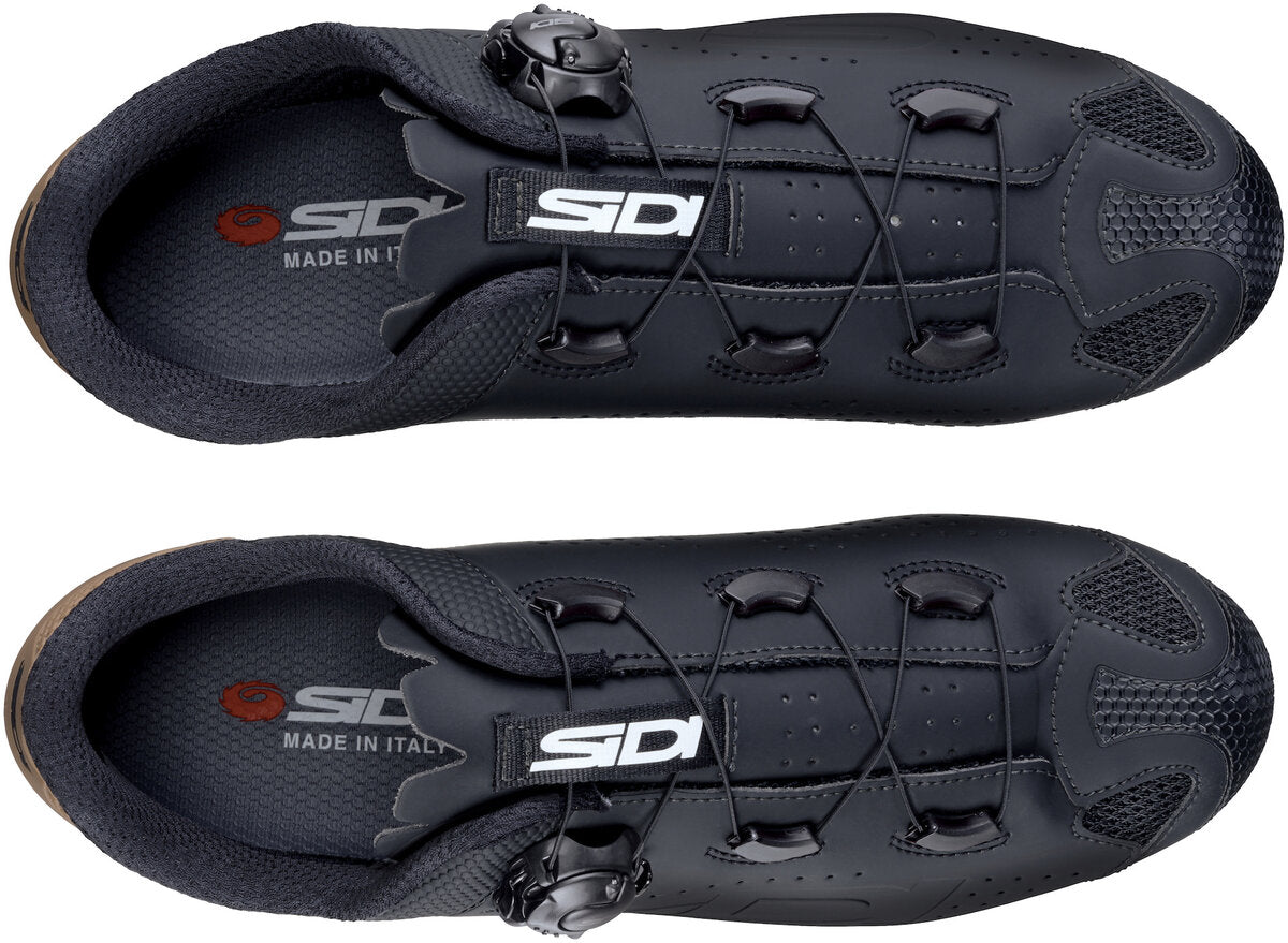 Black cycling shoes with 'SIDI' branding on a white background