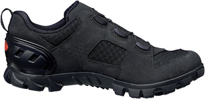 Black shoe from the side with red accent on the heal and mesh fabric