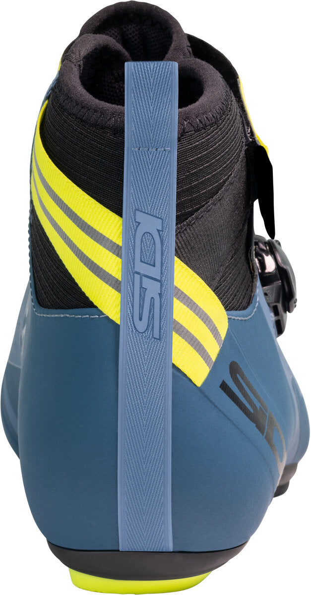 Blue cycling shoe with yellow accents and ISM branding on a white background