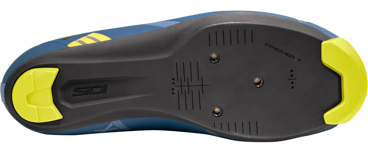 Close-up of a shoe sole with yellow accents on a white background