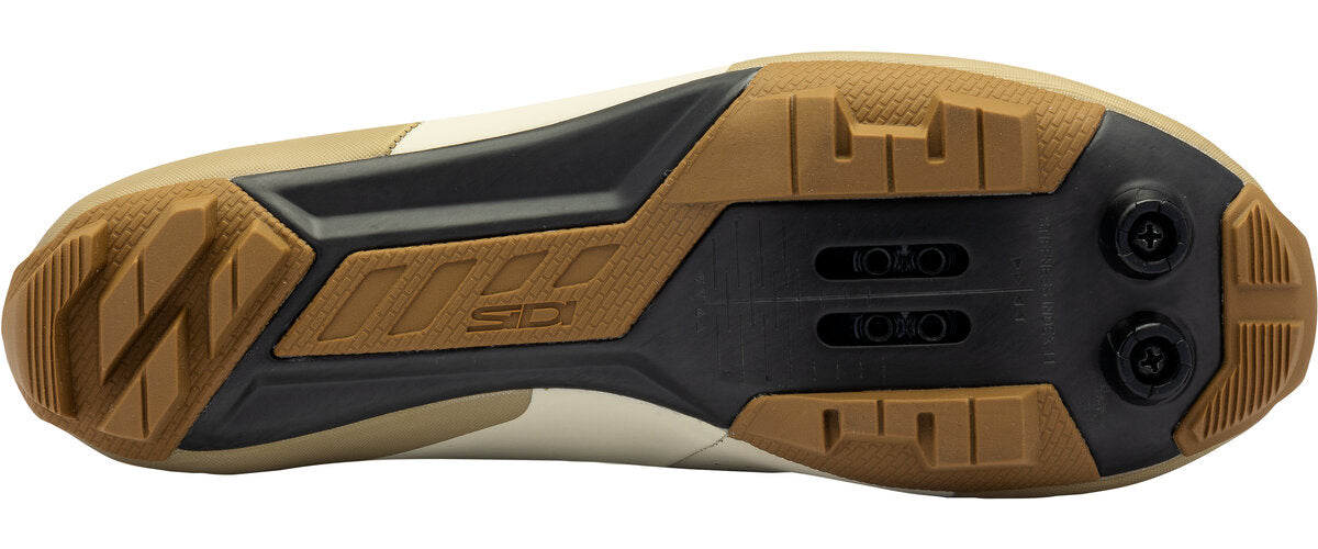 Close-up of a shoe sole with brown and black design on a white background