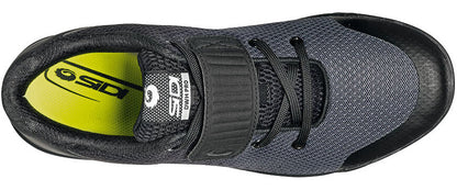 Black cycling shoe from top view with closed velcro strap and yellow inner sole