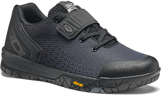 Black cycling shoe from side view with open velcro strap and SIDI logo on it