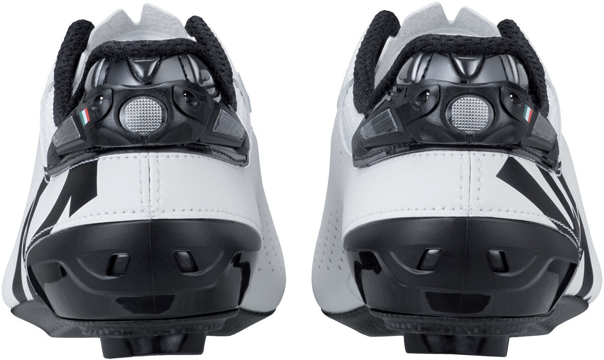 White cycling shoes with black accents on a white background