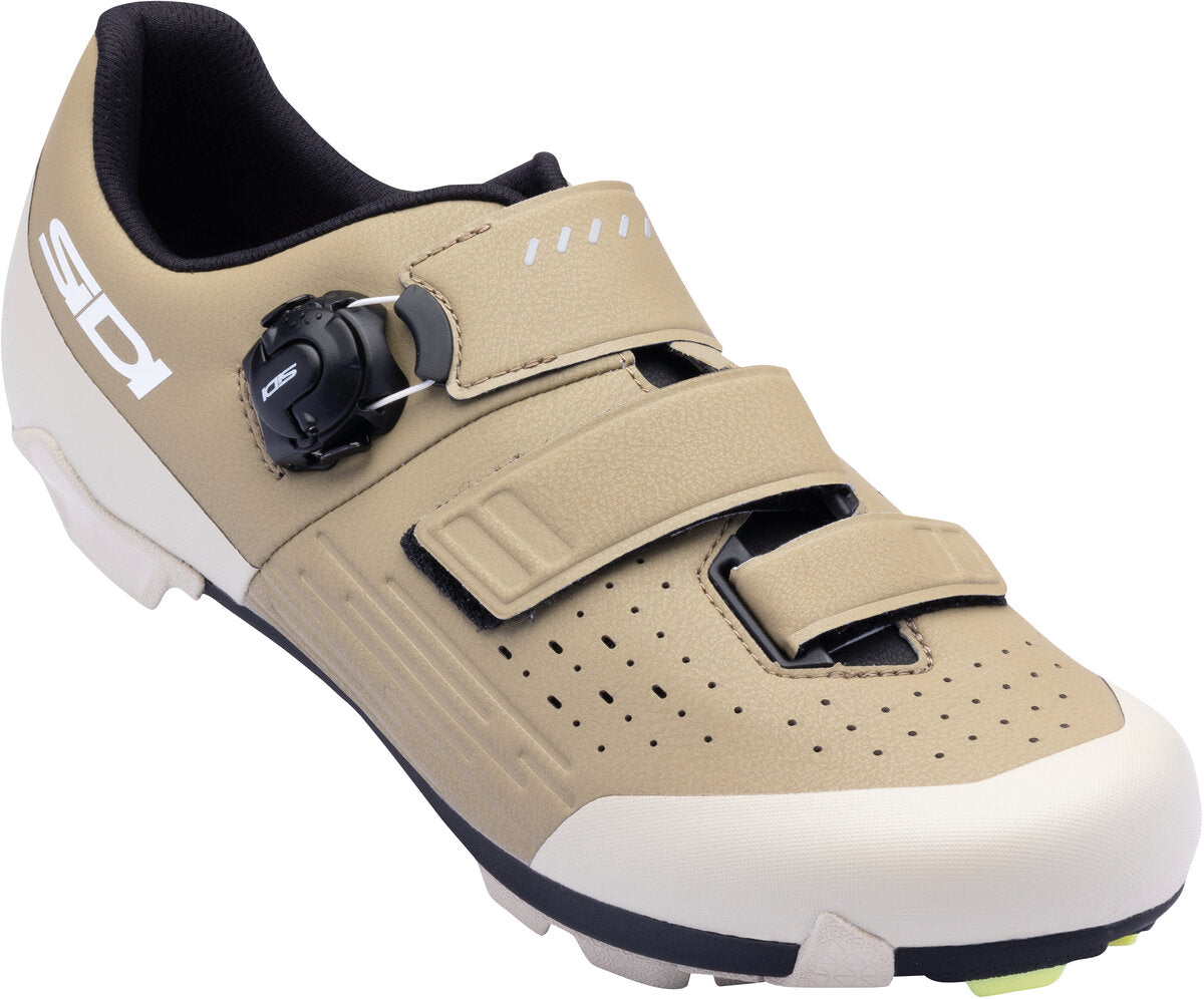 Beige cycling shoe with black accents on a white background