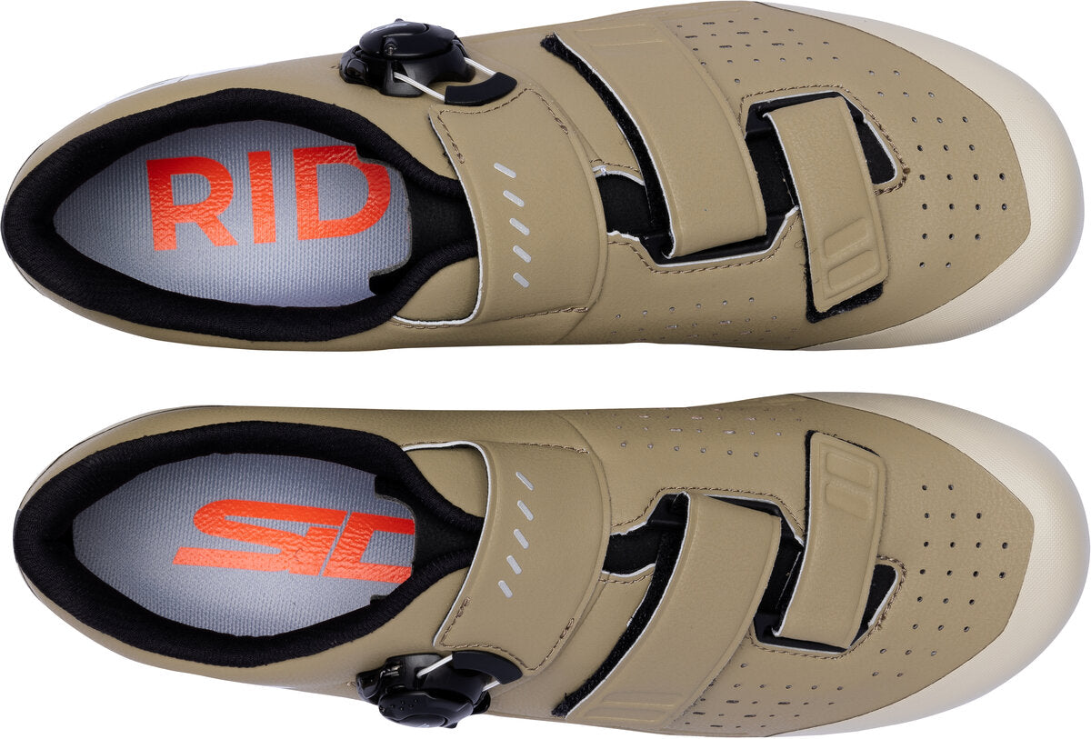 Pair of beige cycling shoes with red and black branding on a white background
