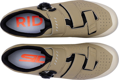 Pair of beige cycling shoes with red and black branding on a white background