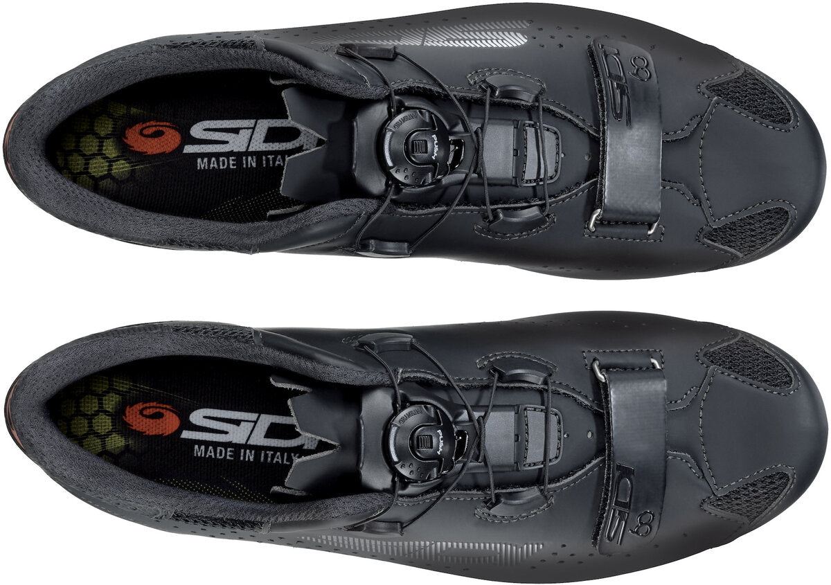 Pair of black cycling shoes with Sidi branding on a white background