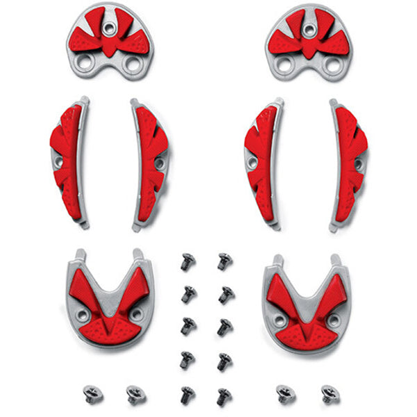 Set of red and silver plate components with screws on a white background