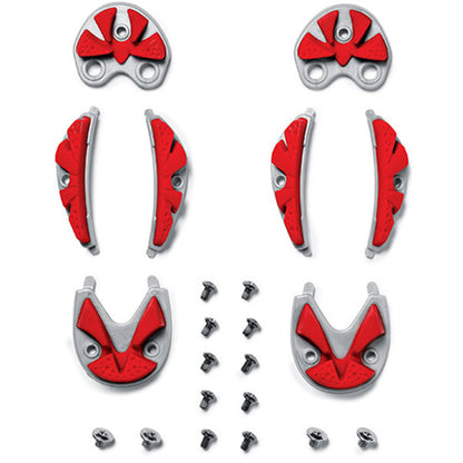 Set of red and silver plate components with screws on a white background