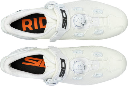White cycling shoes with orange and black 'Ride' branding on a white background