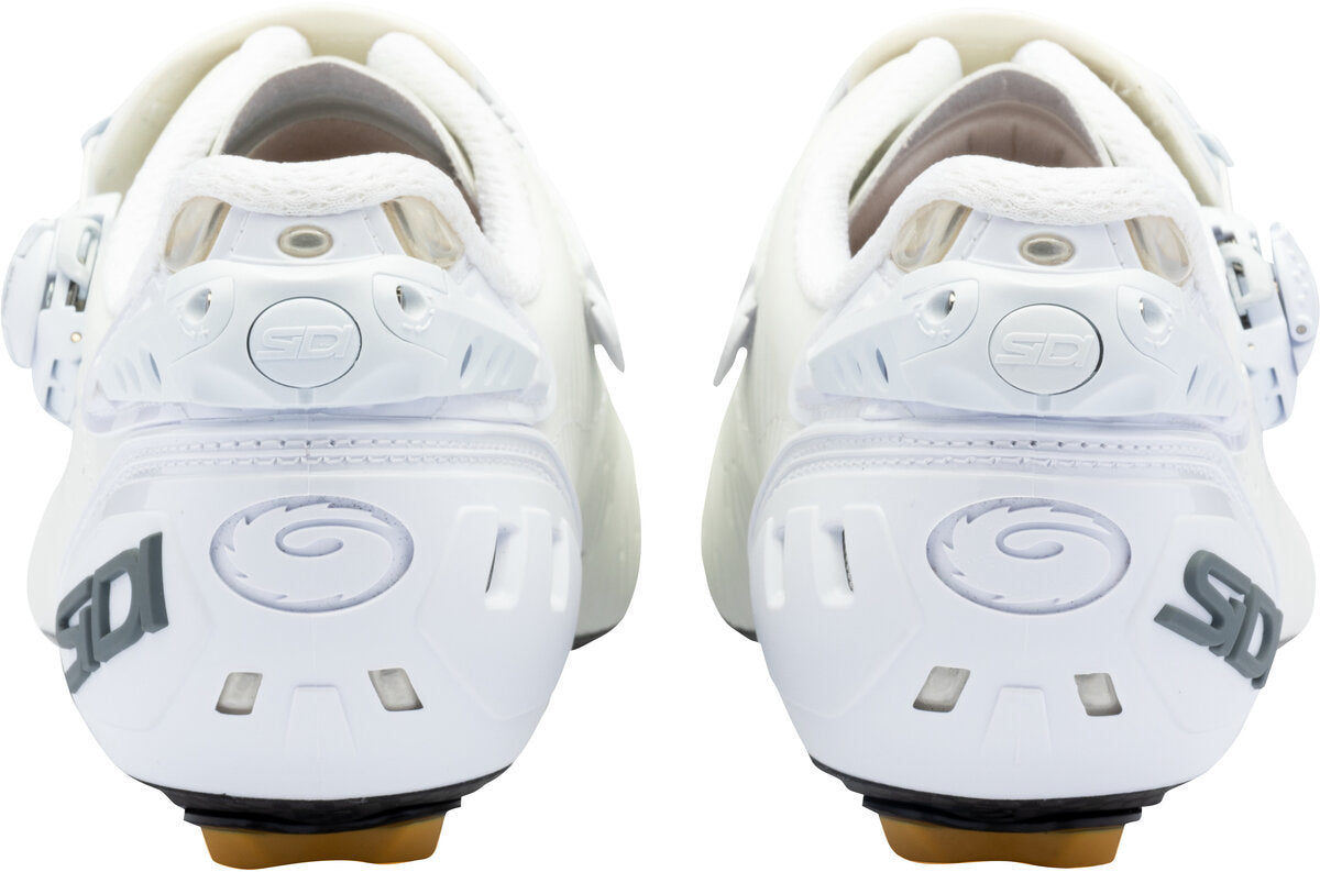 White cycling shoes with brand logo on a white background