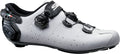 White cycling shoe with black accents on a white background