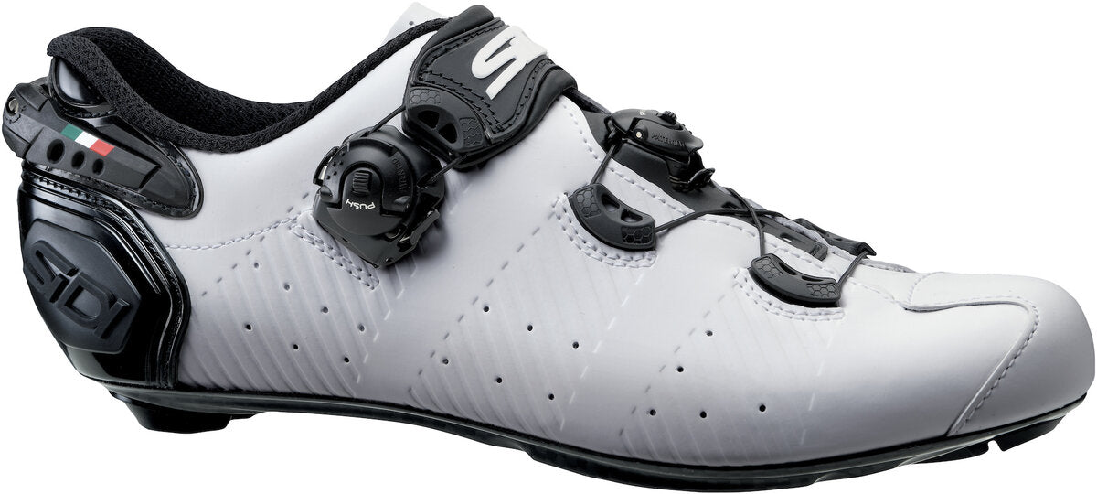 White cycling shoe with black accents on a white background