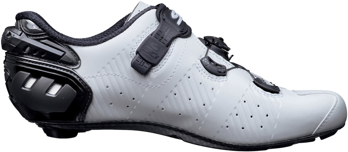 White cycling shoe with black accents on a white background