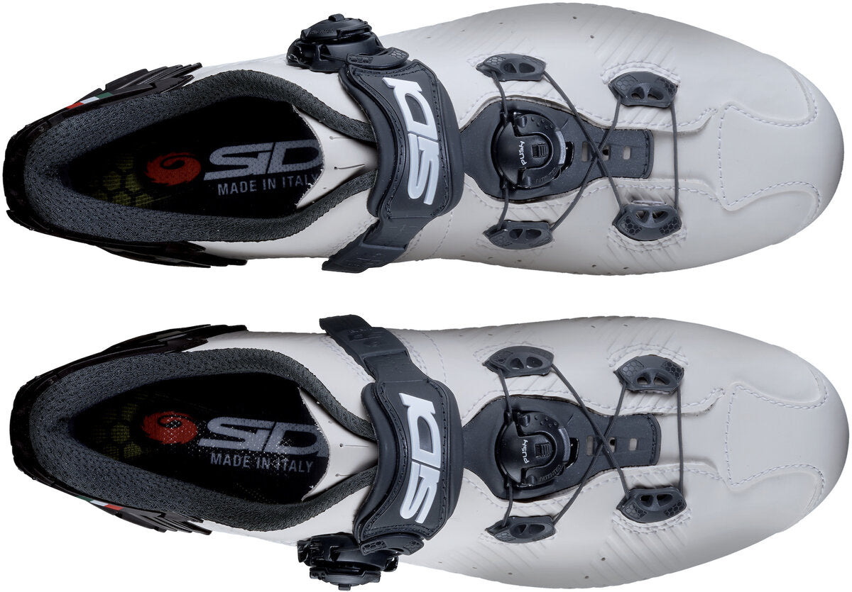 White cycling shoes with black accents and Sidi branding on a white background