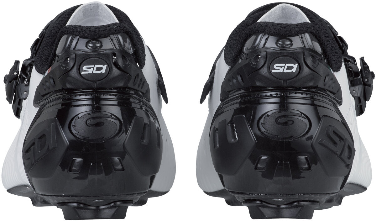Pair of black and white cycling shoes with Sidi branding on a white background
