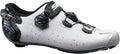 White cycling shoe with black accents on a white background